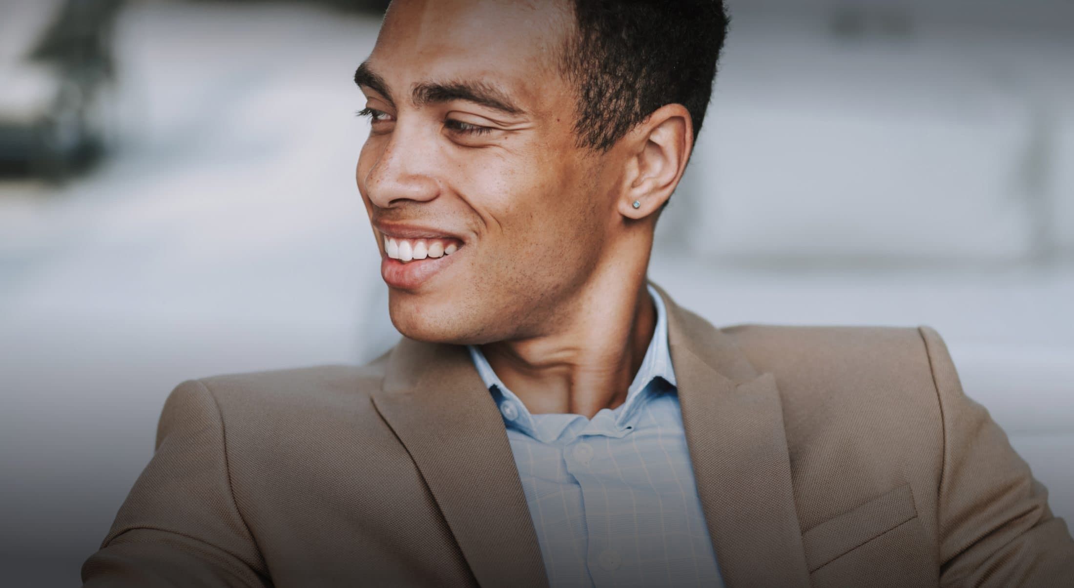 Woman with elegant hairstyle and jewelry indoors.